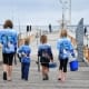 kids walking down a jetty