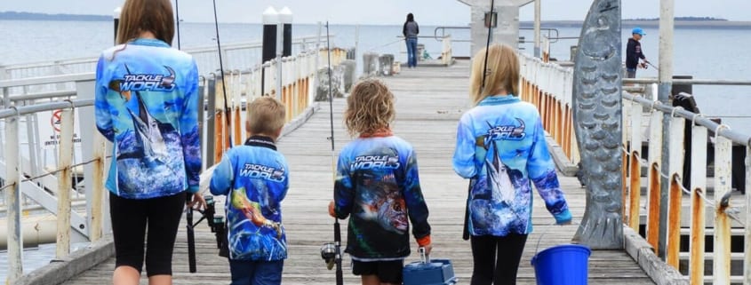 kids walking down a jetty