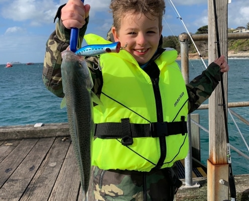 Tackle World's Local Hero Dexter with a great salmon caught on a popper