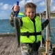 Tackle World's Local Hero Dexter with a great salmon caught on a popper