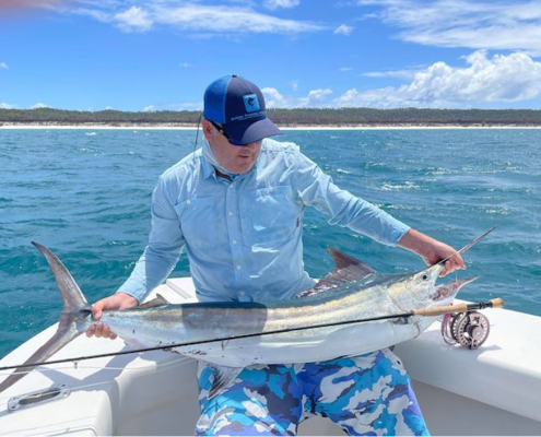 Brent Hancock from Tackle World Port Stephens with a juvenile black marlin caught on the fly.